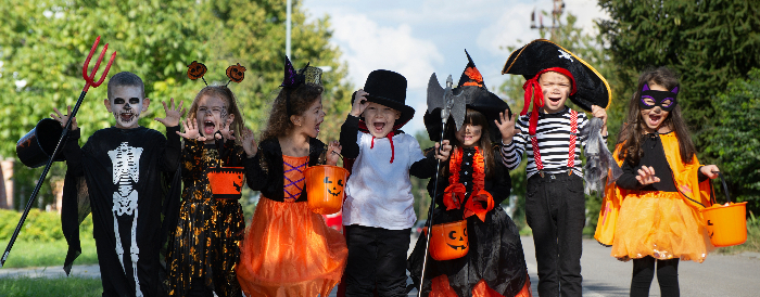 Kids Trick or Treating in Halloween Costumes.