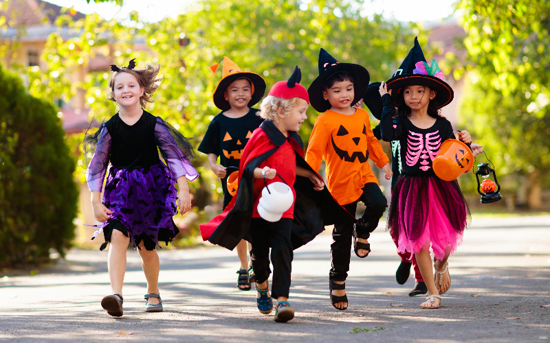 Kids Trick or Treating in Halloween Costumes.