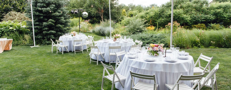 Garden wedding reception table setting.