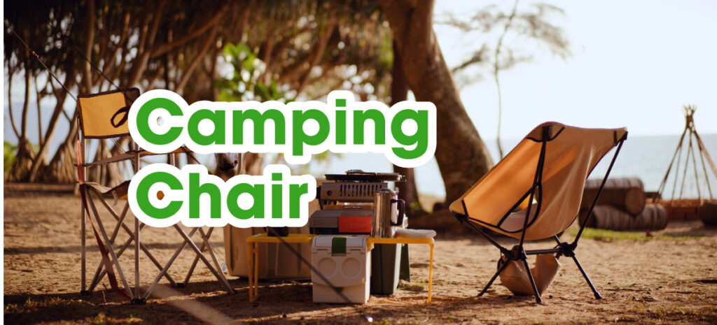 Camping chairs and cooking tools set up on a camp ground.