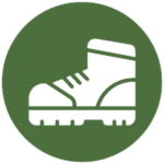 Green icon illustrating a hiking boots