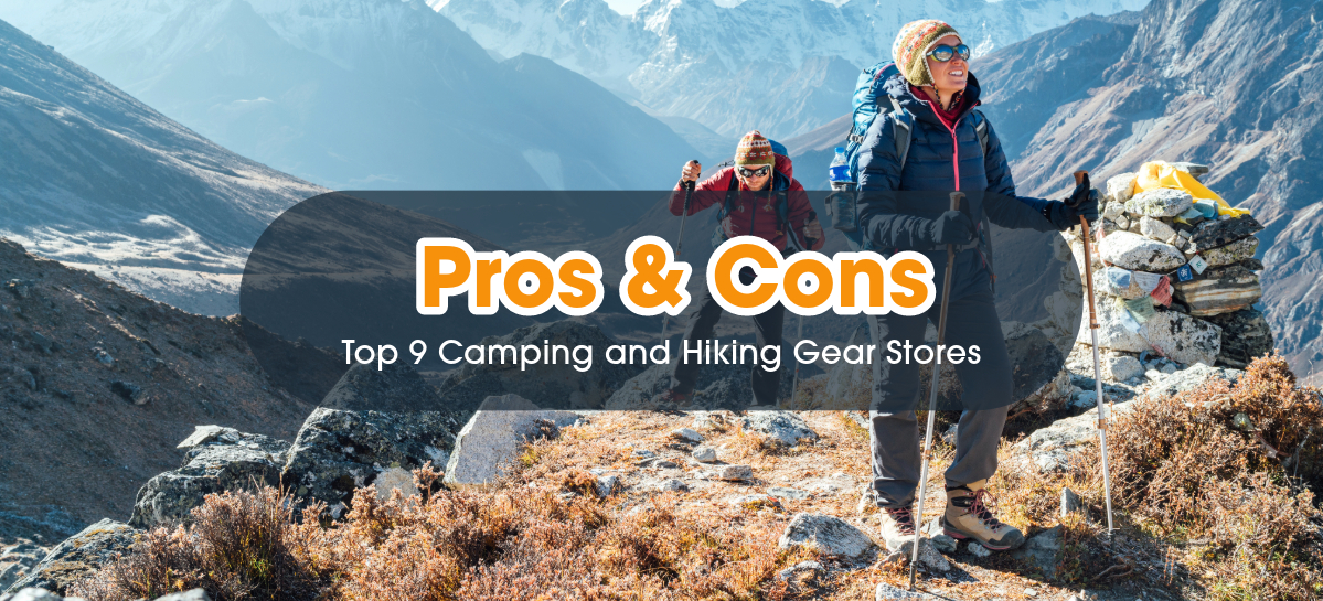 Two hikers standing at the snowy mountain top.