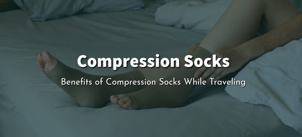 A person sitting on a bed and putting on a compression socks.