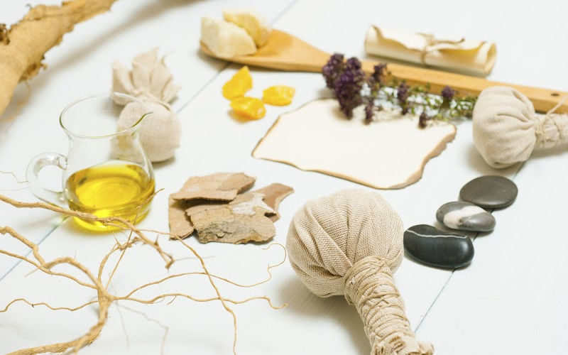 A bunch of homemade skin care products displayed on a table