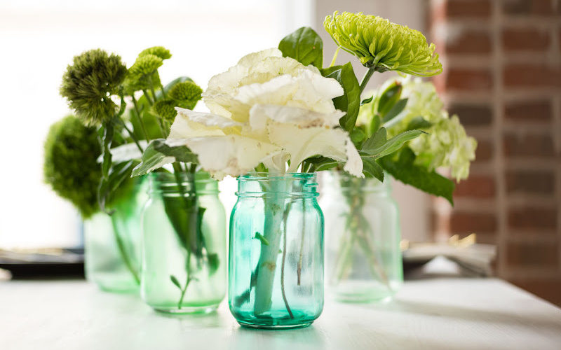 Tint mason jars displayed with flowers