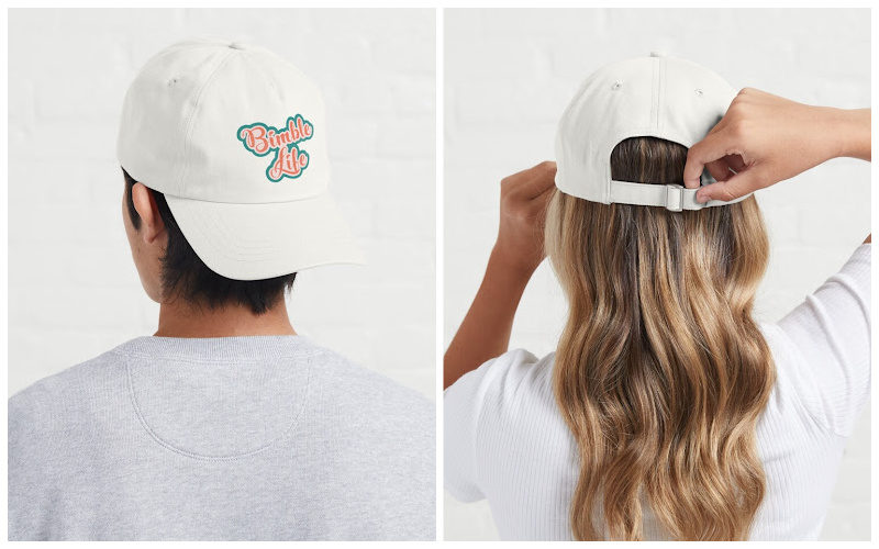 Rear view of two people wearing white dad hats.