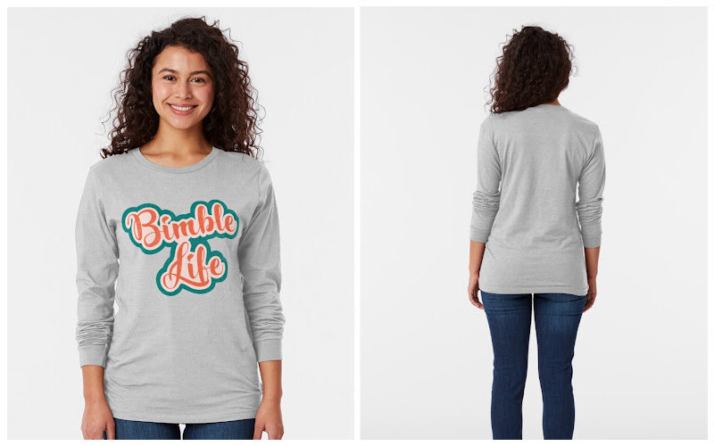 A woman wearing a ight grey graphic long t-shirt that says Bimble Life.