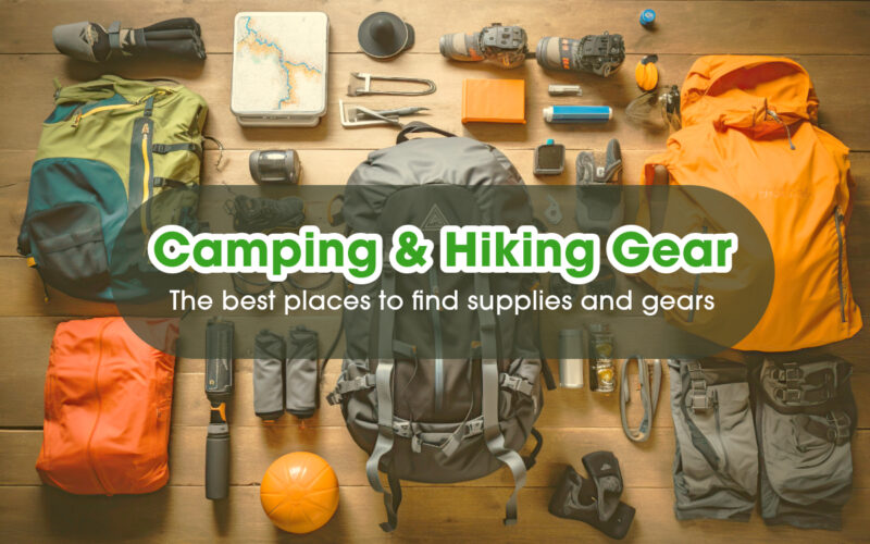 Hiking and camping gears lay on a wooden floor.