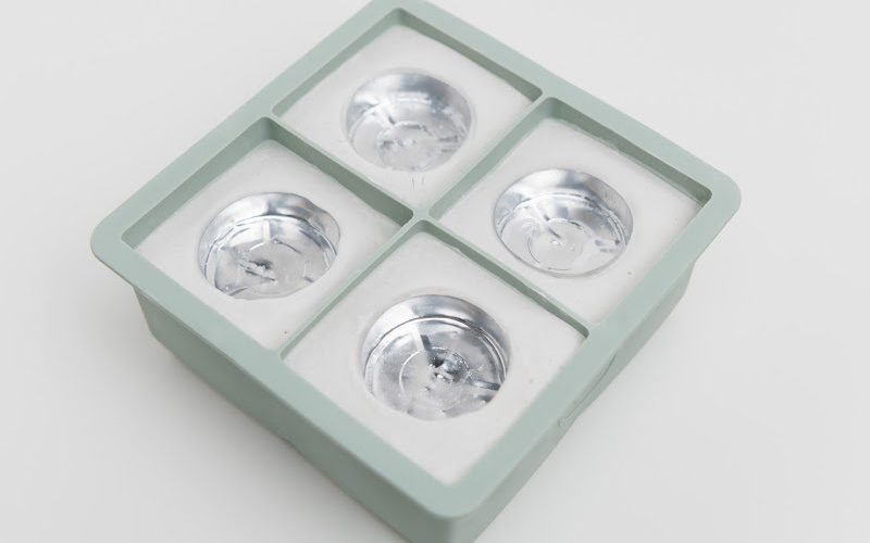 Four tealight candles in a square box