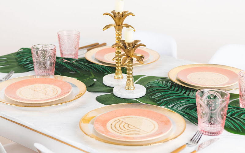 A decorated dinner table in peach and gold theme