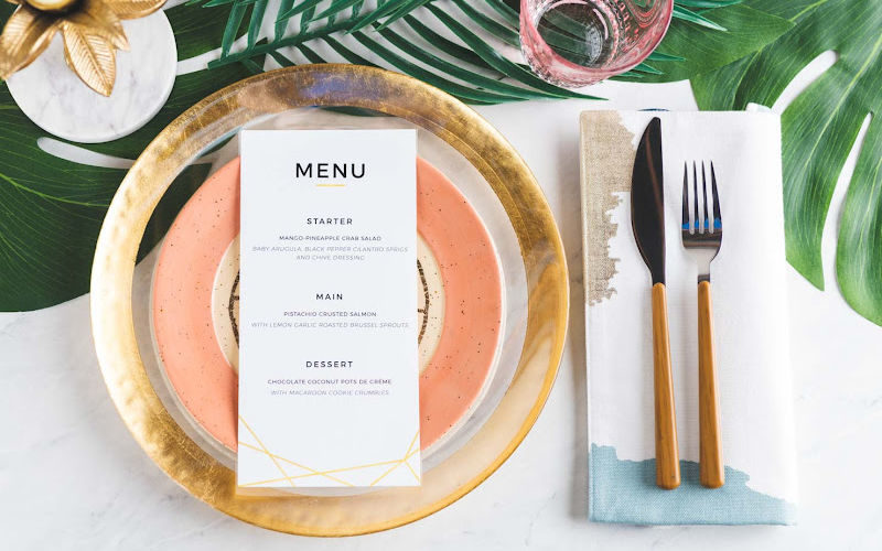 A set of dinnerware with menu card