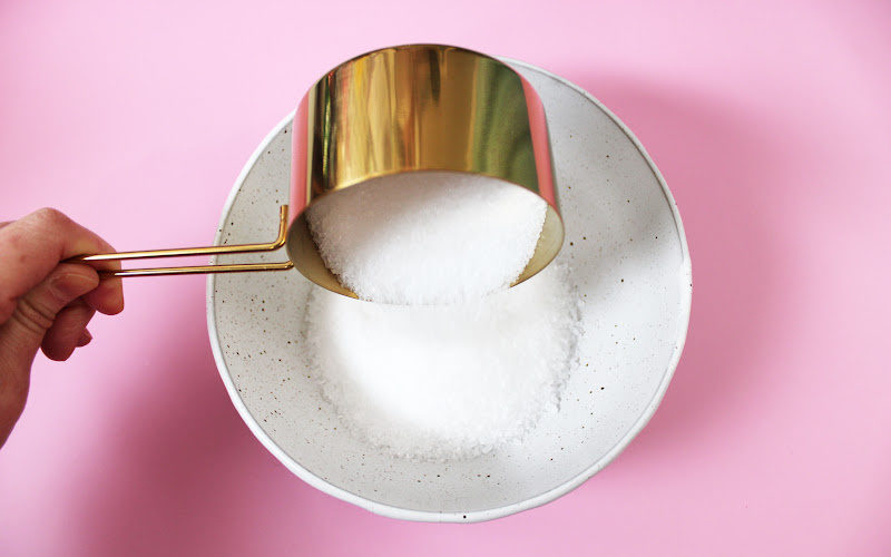 Pouring Epsom salt to a ceramic bowl