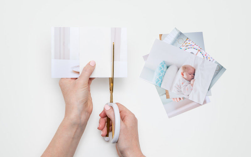 cutting through a paper with a scissor