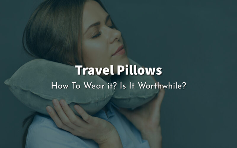 A woman wearing a travel pillow and taking a nap.