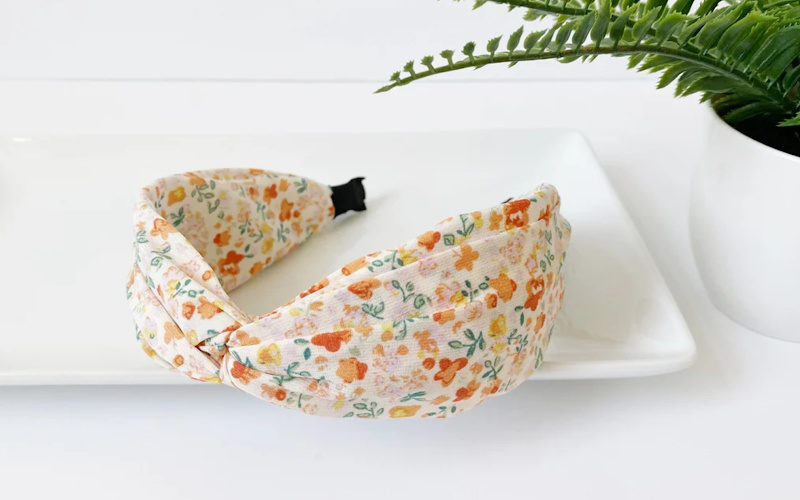 Soft colored vintage floral wide padded headband.